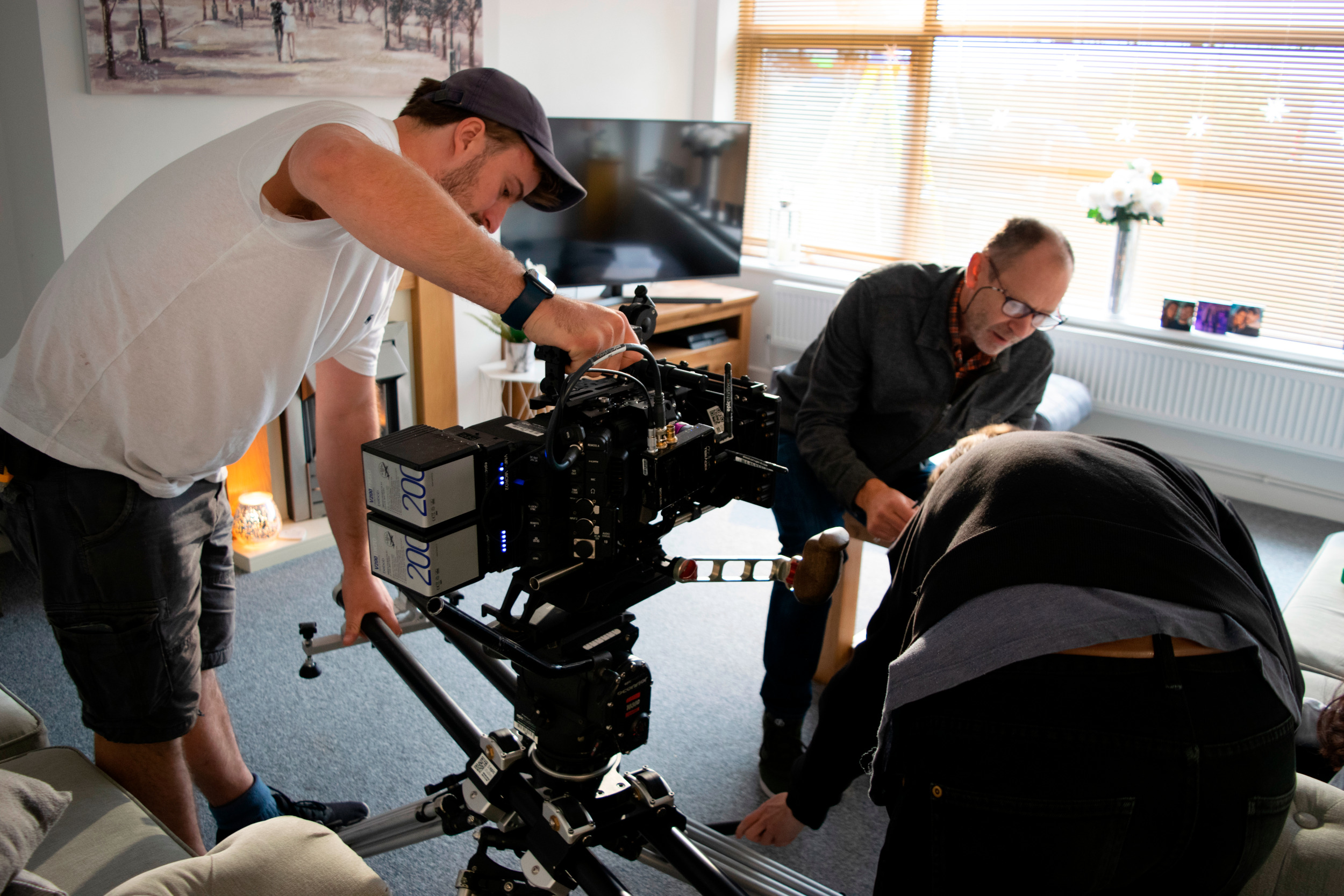 a group of men working on a camera